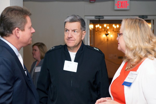 Maj. Gen. Steven Smith, USA (c), director, U.S. Army Cyber Directorate, drops by the September luncheon to hear current and future requirements and priorities for PEO EIS in fiscal year 2014.